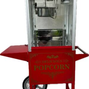 Rote Popcornmaschine mit Wagen, beschriftet mit "Hot & Fresh" und "Delicious Popcorn", im klassischen Design